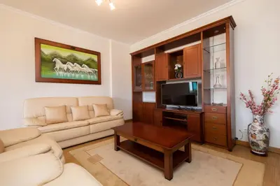a living room with a couch and a tv at Anadia Penthouse Duplex by Rent-a-key in Funchal