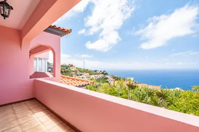 a balcony with a view of the ocean at Amendoeira Residence by Homie in Ponta do Sol