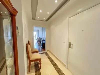 a hallway with a chair and a sliding glass door at Casa Delores, by Specialstays in Funchal