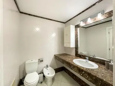 a bathroom with a toilet and a sink and a mirror at Casa Delores, by Specialstays in Funchal