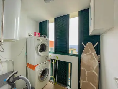 a laundry room with a washing machine and a window at Casa Delores, by Specialstays in Funchal