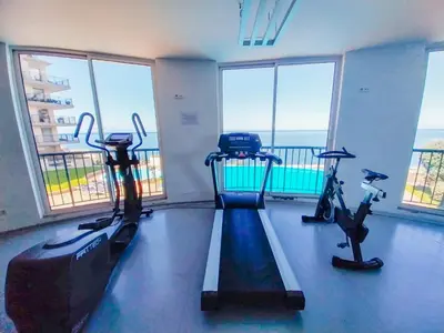 a gym with two treadmills and two exercise bikes at Casa Delores, by Specialstays in Funchal