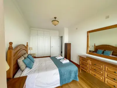 a bedroom with a large bed and a large mirror at Casa Delores, by Specialstays in Funchal