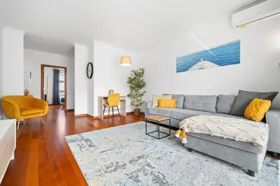 a living room with a couch and a table at Madalenas Holiday Retreat - Free Parking in Funchal in Funchal