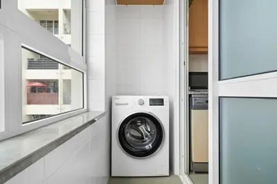 a laundry room with a washer and dryer at Madalenas Holiday Retreat - Free Parking in Funchal in Funchal