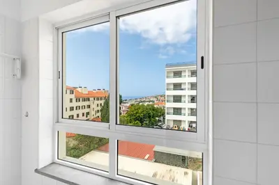 a window with a view of a city at Madalenas Holiday Retreat - Free Parking in Funchal in Funchal
