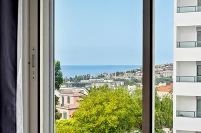 a window with a view of a city at Madalenas Holiday Retreat - Free Parking in Funchal in Funchal