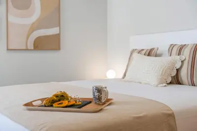 a tray of food sitting on top of a bed at Casa das Raposinhas VII in Funchal
