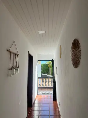 a hallway with a hallway leading to a room at Sunny Calheta Apartment MQ3 & Mountain View & Near Beach in Calheta