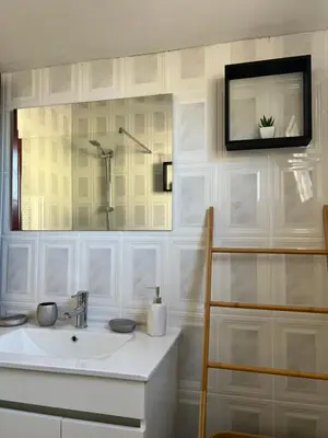 a white bathroom with a sink and a mirror at Sunny Calheta Apartment MQ3 & Mountain View & Near Beach in Calheta