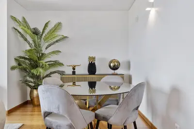 a dining room with a table and chairs at The Ocean Gaze by Homie in Funchal