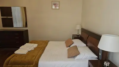 a bedroom with a bed with towels on it at Jose & Idalina House in Funchal