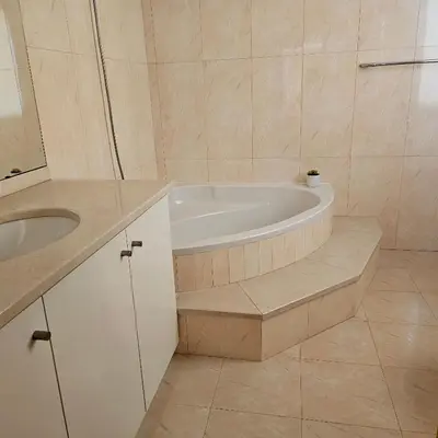 a bathroom with a bath tub and a sink at Jose & Idalina House in Funchal