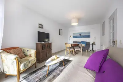 a living room with a couch and a table at CoolHouses Algarve Luz, Sunny Luz in Luz