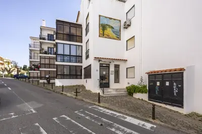 a white building on the side of a street at CoolHouses Algarve Luz, Sunny Luz in Luz