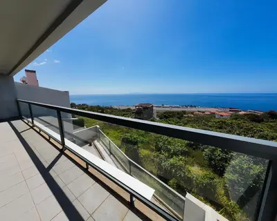 a balcony with a view of the ocean at Moradia Garcês in Santa Cruz