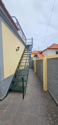 a staircase on the side of a building at Casa do Juvenal in Funchal