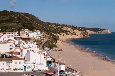 a view of a beach with white houses and the ocean at Casa Maresia da Salema in Salema