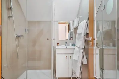 a bathroom with a shower and a sink at Nati by KAAMAH in Ribeira Brava