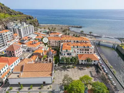 an aerial view of a town with a clock tower at Nati by KAAMAH in Ribeira Brava