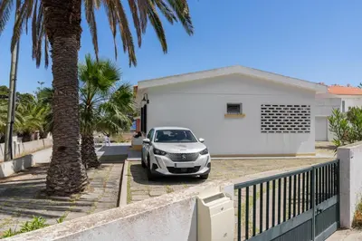 a white car parked in front of a house at Vivenda do Moinho Refuge in Porto Santo in Porto Santo