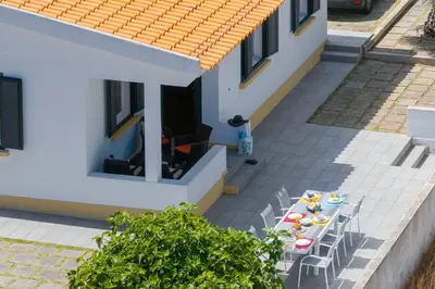 an overhead view of a house with a table and chairs at Vivenda do Moinho Refuge in Porto Santo in Porto Santo
