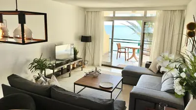 a living room with a couch and a table at MaraHomes in Funchal