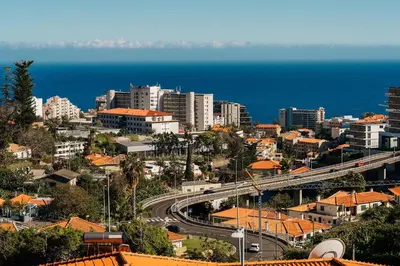 a view of a city from a balcony at GuestReady - Homely stay in Funchal in Funchal