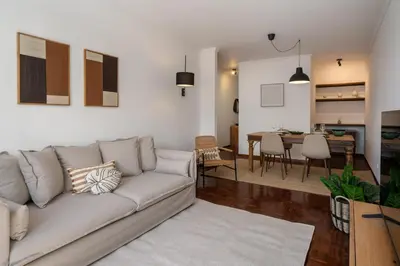 a living room with a couch and a dining room at Quebra Costas I by An Island Apart in Funchal