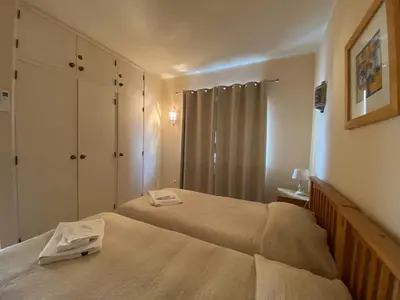 a bedroom with two beds with towels on them at Luz dream apartment 22G above beach in Luz