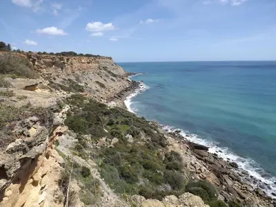 an aerial view of the ocean and a rocky coastline at Burgau Ocean View Apartment in Burgau