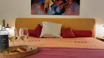 a living room with a table and a couch at Vivenda Romana - By Staywise in Lagos
