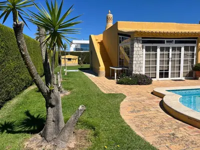 a house with a swimming pool in the yard at Vivenda Romana - By Staywise in Lagos