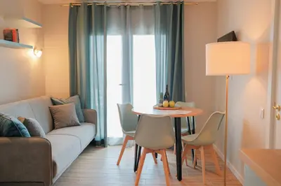 a living room with a couch and a table at Ocean Bay Panoramic View in Funchal