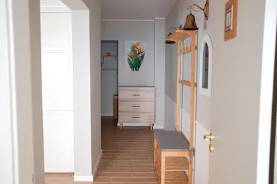 a hallway with a door and a dresser in a room at Ocean Bay Panoramic View in Funchal