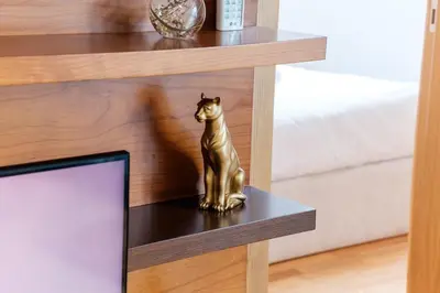 a statue of a cat sitting on top of a table at GuestReady - Serene Funchal Getaway in Funchal