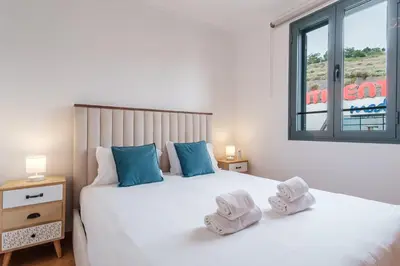 a bedroom with a bed with towels on it at GuestReady - Serene Funchal Getaway in Funchal