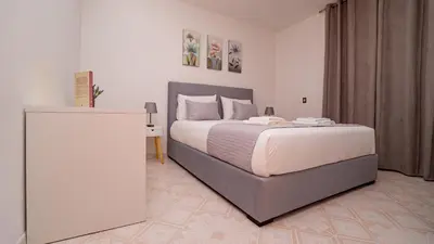 a bedroom with a large bed in a room at Casa Conceição in Ribeira Brava