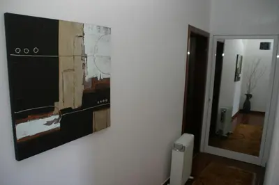 a painting hanging on a wall in a room at Casa do Prendinha A in Ponta do Pargo