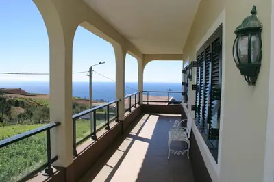 a balcony with a view of the ocean at Casa do Prendinha A in Ponta do Pargo