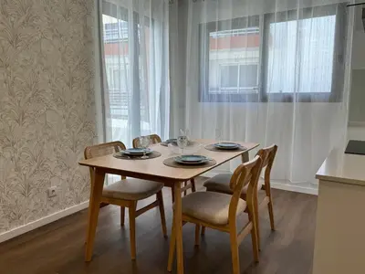 a dining room table with chairs and a table and chairsktop at Stay In Virtudes II in Funchal
