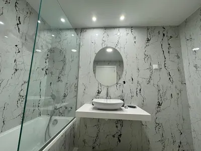 a bathroom with a sink and a mirror and a tub at Stay In Virtudes II in Funchal