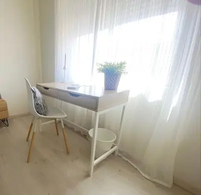 a desk with a potted plant on it next to a window at 2 minutes walk to the beach Praia da Luz - Casa da Maria in Luz