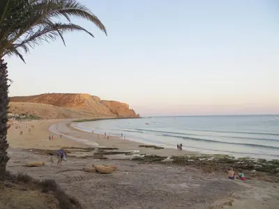 a group of people on a beach with the ocean at 2 minutes walk to the beach Praia da Luz - Casa da Maria in Luz