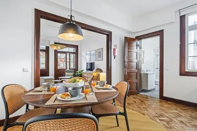 a dining room with a table and chairs at Zino Apartment A - By Wehost in Funchal