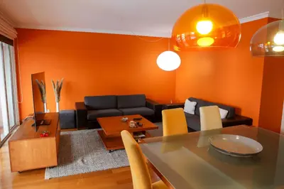 a living room with a couch and a table at BiBel Apartment in Funchal