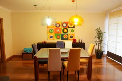 a dining room with a table and chairs at BiBel Apartment in Funchal
