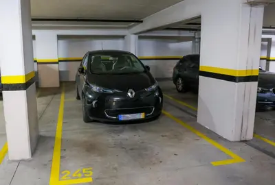 a small black car parked in a parking garage at BiBel Apartment in Funchal