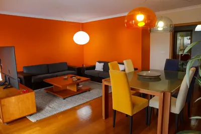 a living room with a table and a couch at BiBel Apartment in Funchal