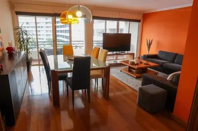 a living room with a dining table and a couch at BiBel Apartment in Funchal